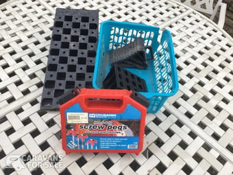 Levelling ramp, chocks and screw in awning pegs