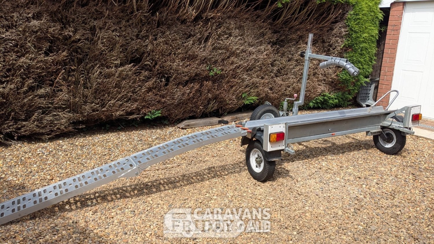 Side loading motorcycle trailer