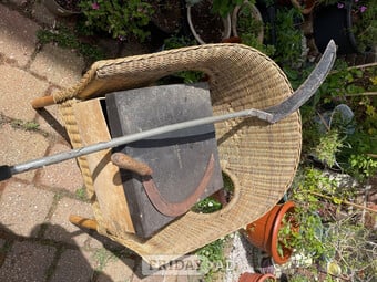 Two scythes one hand held the other long handled