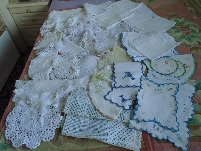 various collections of laces/crochets/embrodiery and the like. dressing table sets, runners  etc.