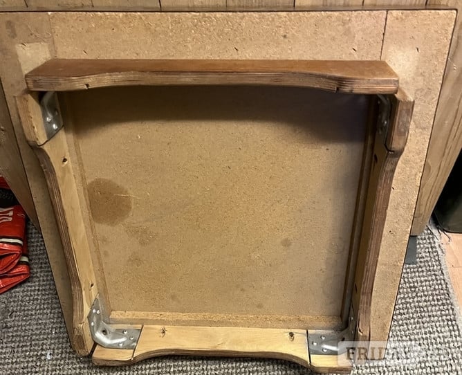 A Square table with removable screw and nut legs