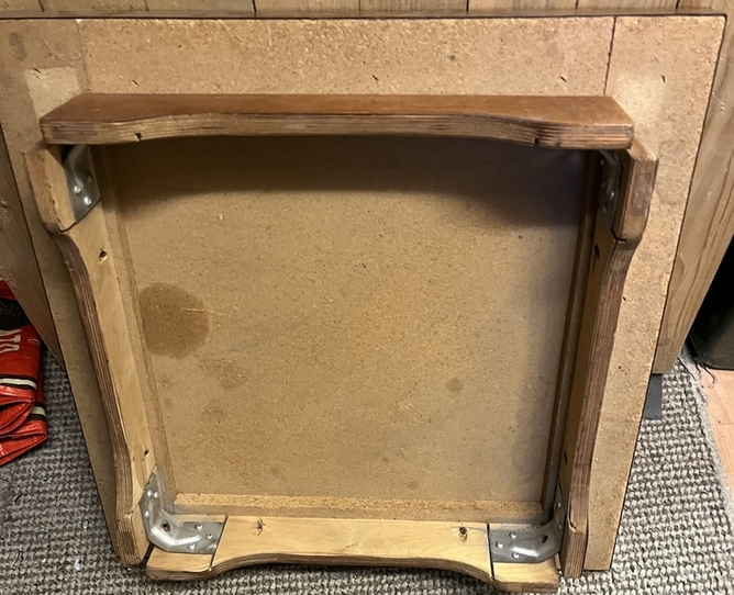 A Square table with removable screw and nut legs