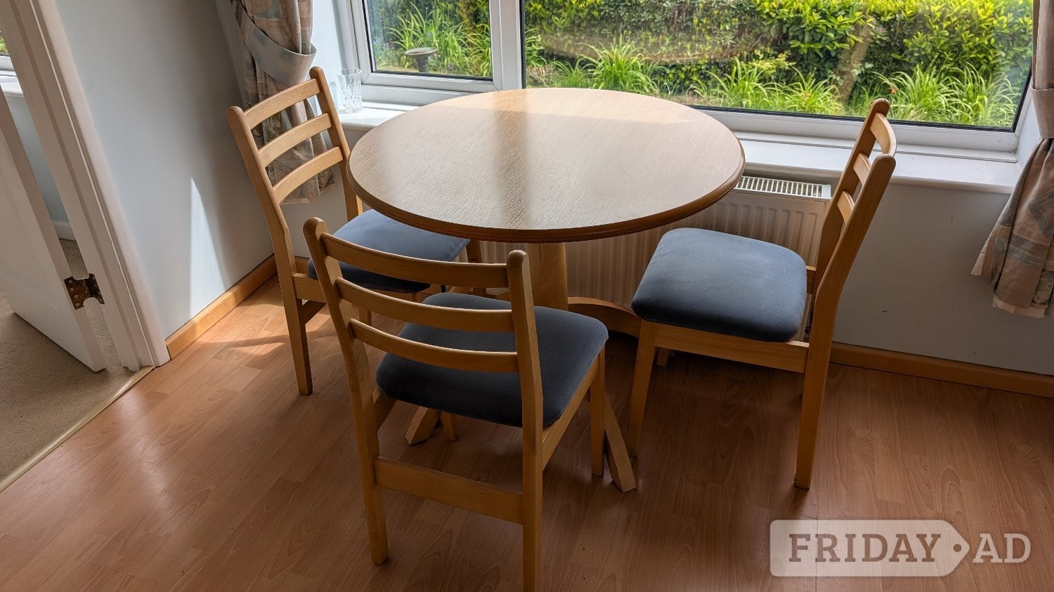 Light wood colour small dining table & 3 chairs with padded seats in Robertsbridge