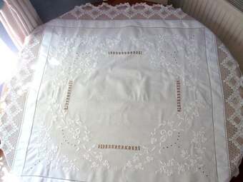 Tablecloth, white embroidered with lace surround.
