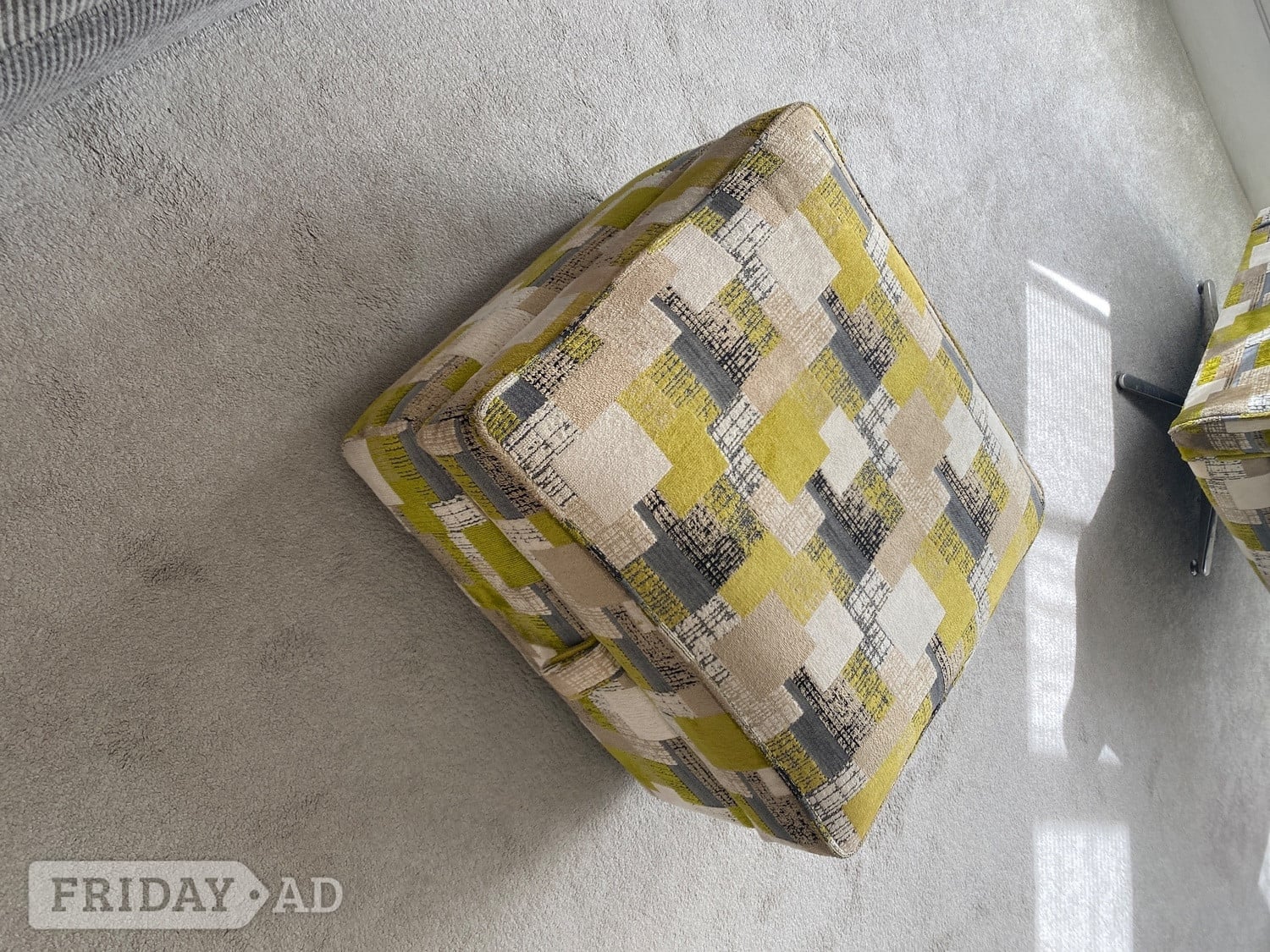 Swivel armchair with footstool in Hove