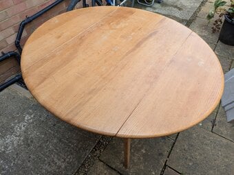 Ercol extending dining table with 6 chairs.