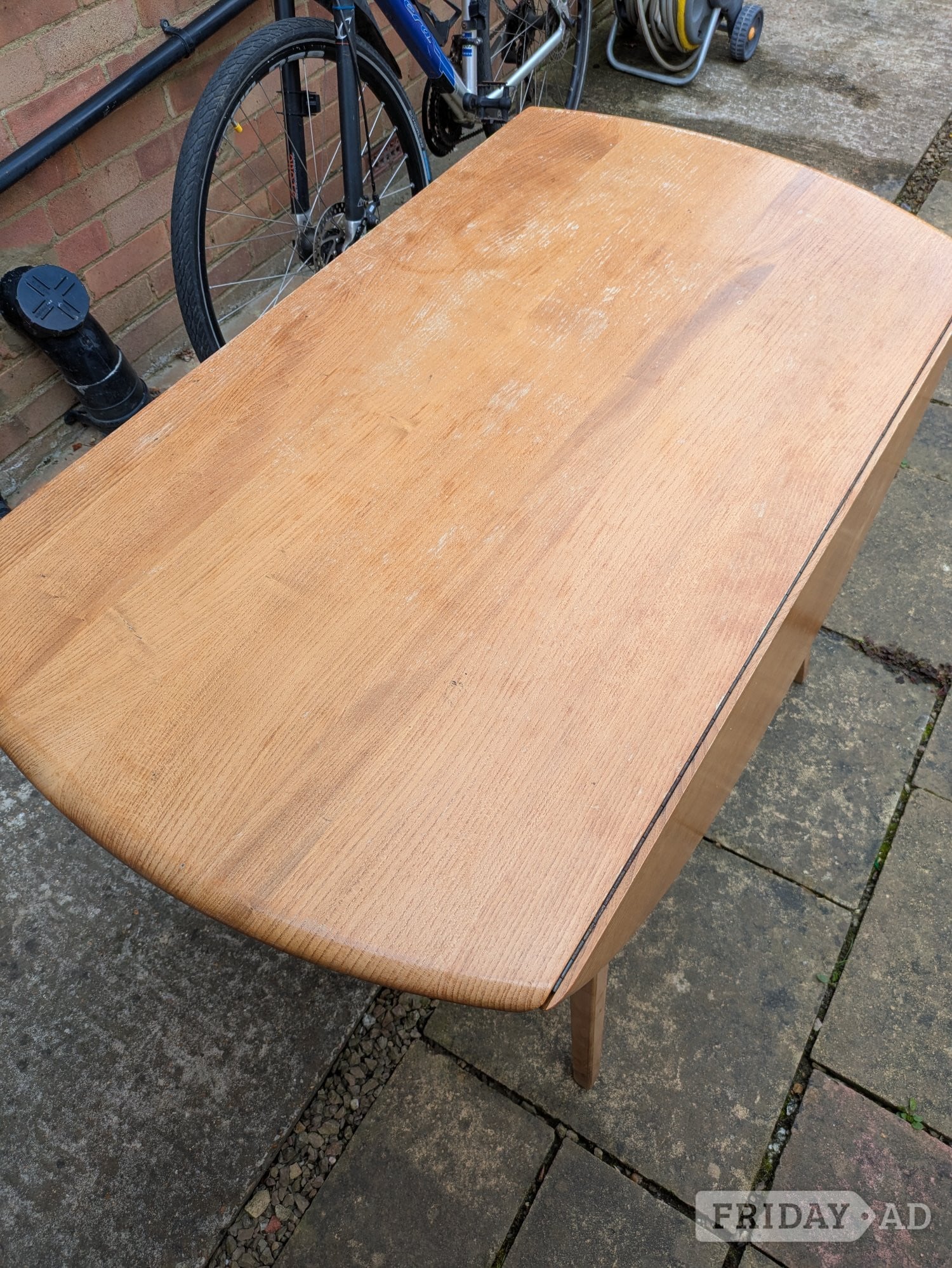 Ercol extending dining table with 6 chairs.