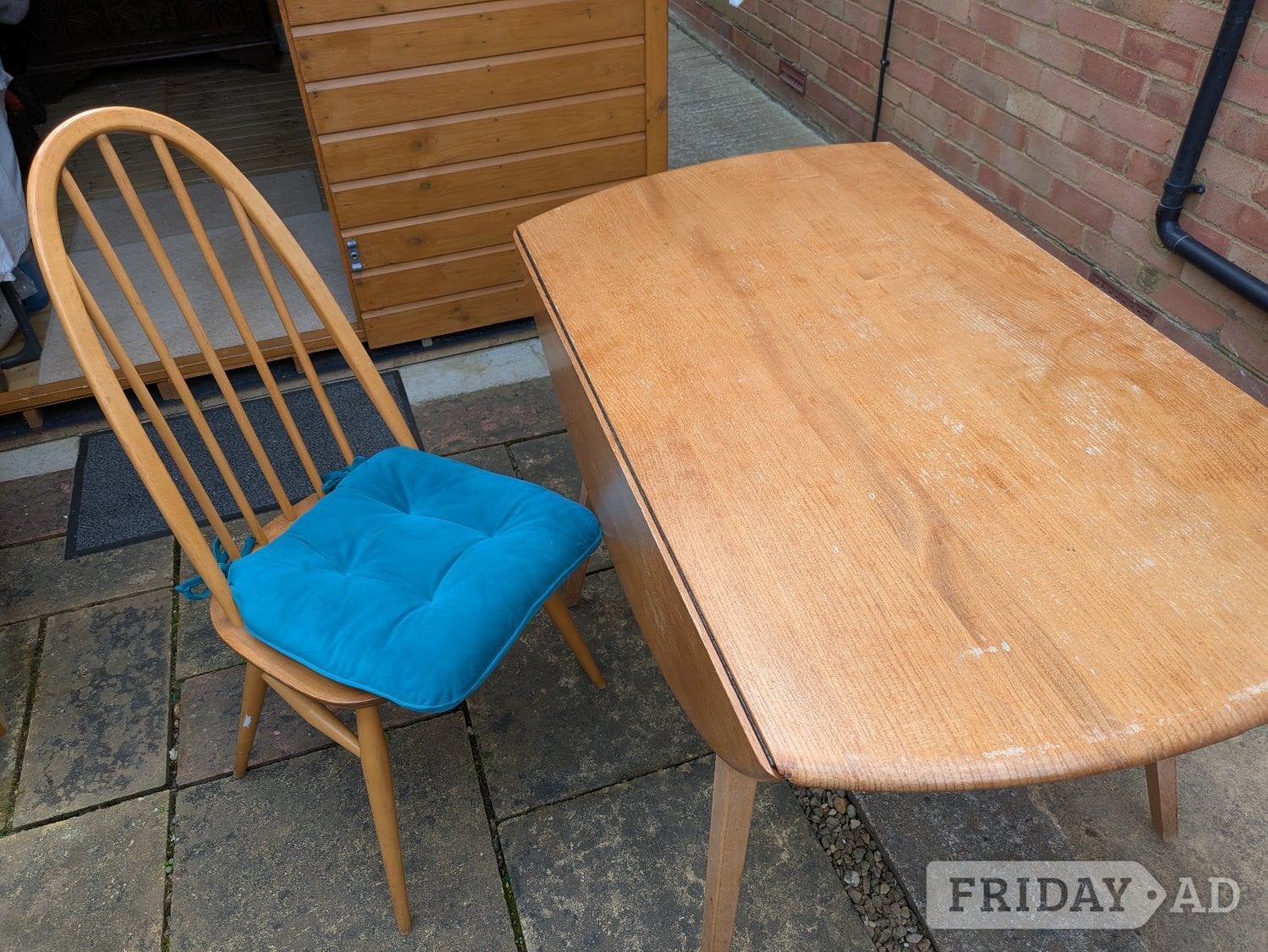Bexhill-On-Sea Ercol extending dining table with 6 chairs.