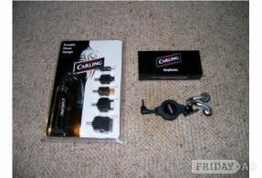 PORTABLE MOBILE PHONE CHARGER AND EARPHONES.