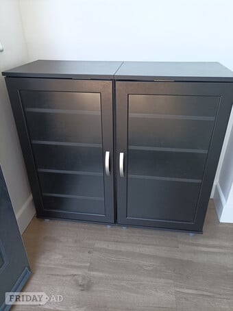 Pair of 4/5 shelf black wooden storage cabinets.