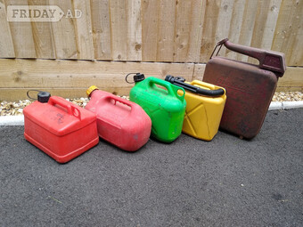 Four Used Plastic Petrol Cans