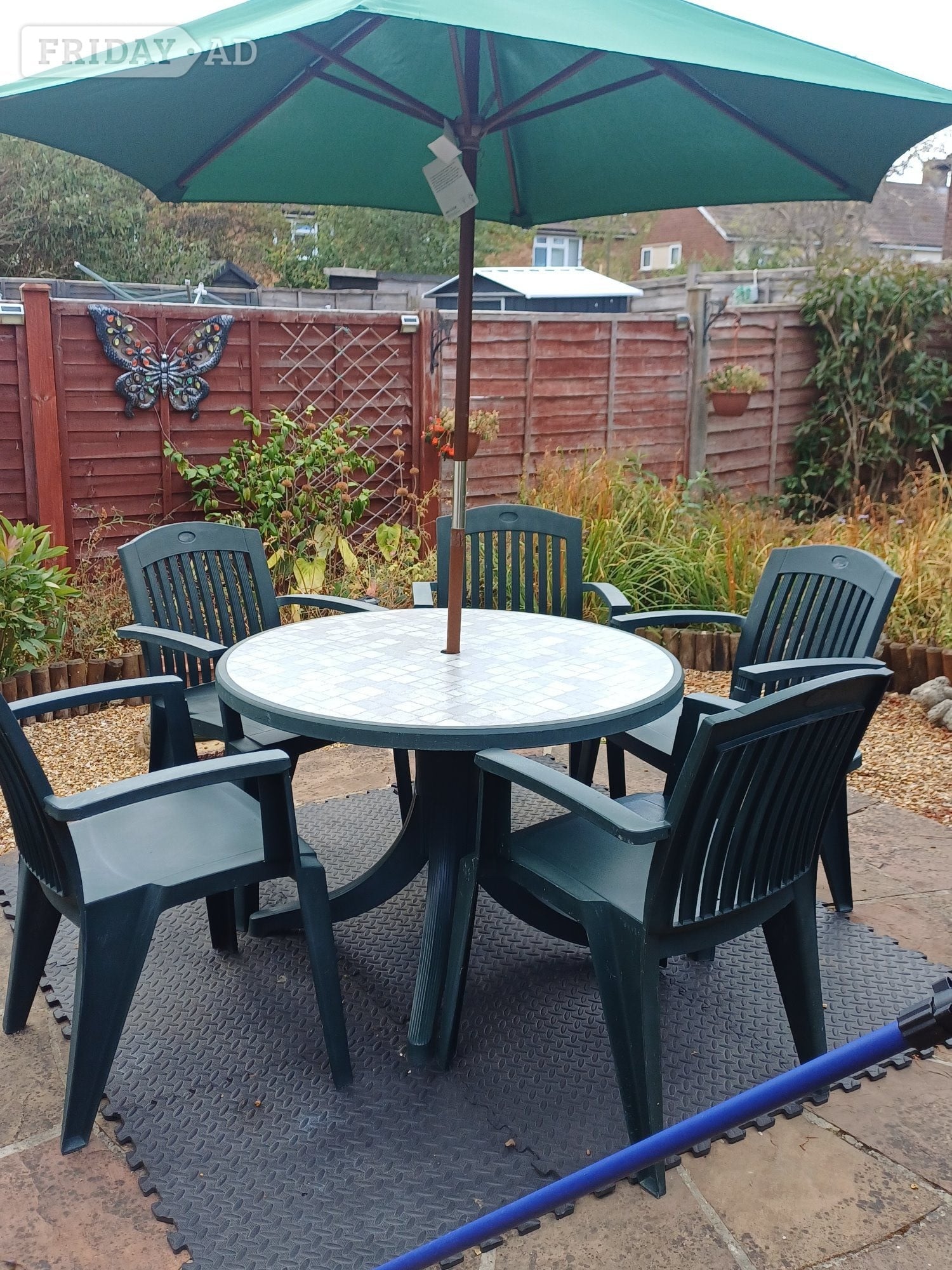 Welwyn Garden City Round garden table with 5 matching chairs & parasol