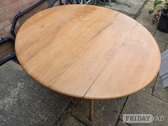 Ercol extending dining table with 6 chairs.