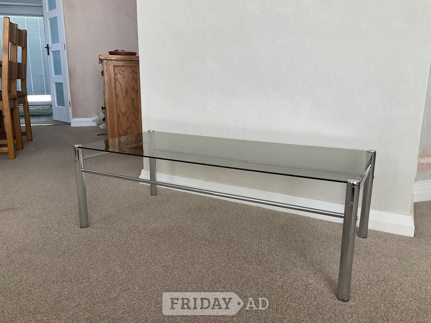 FREECoffee table. Smoked glass top, chrome frame. 43” x 20” x 15” in Littlehampton