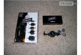 PORTABLE MOBILE PHONE CHARGER AND EARPHONES.