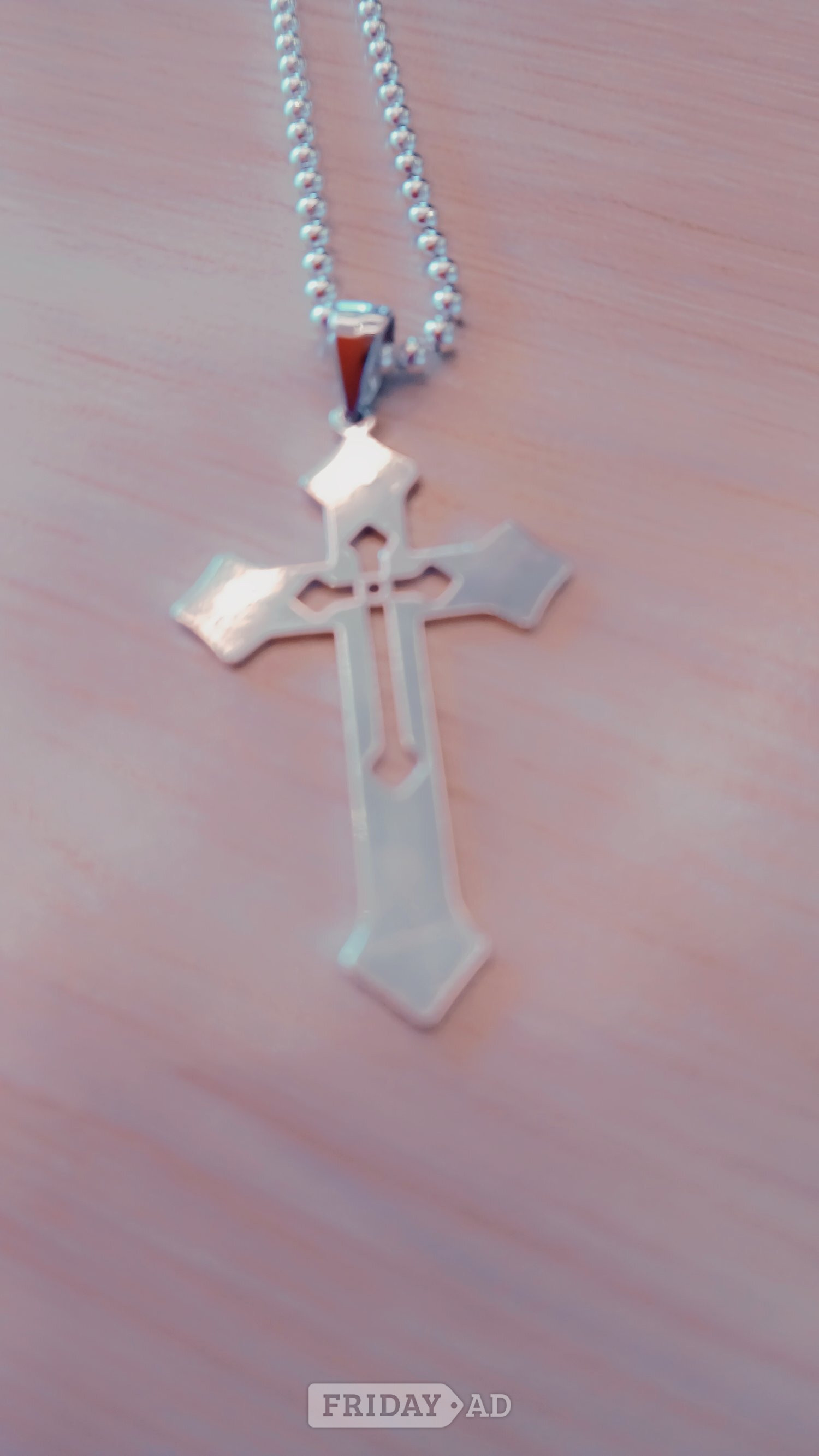 Silver neckless and silver cross in Folkestone
