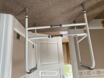 Adjustable toilet frame