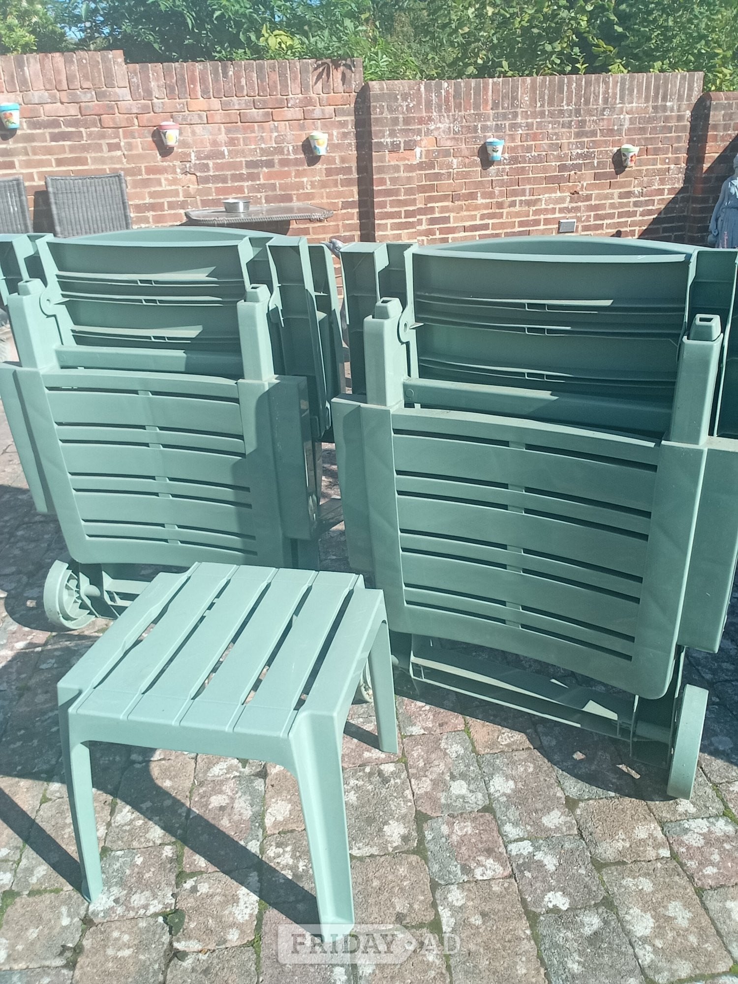 Two sunbeds with cushions and table