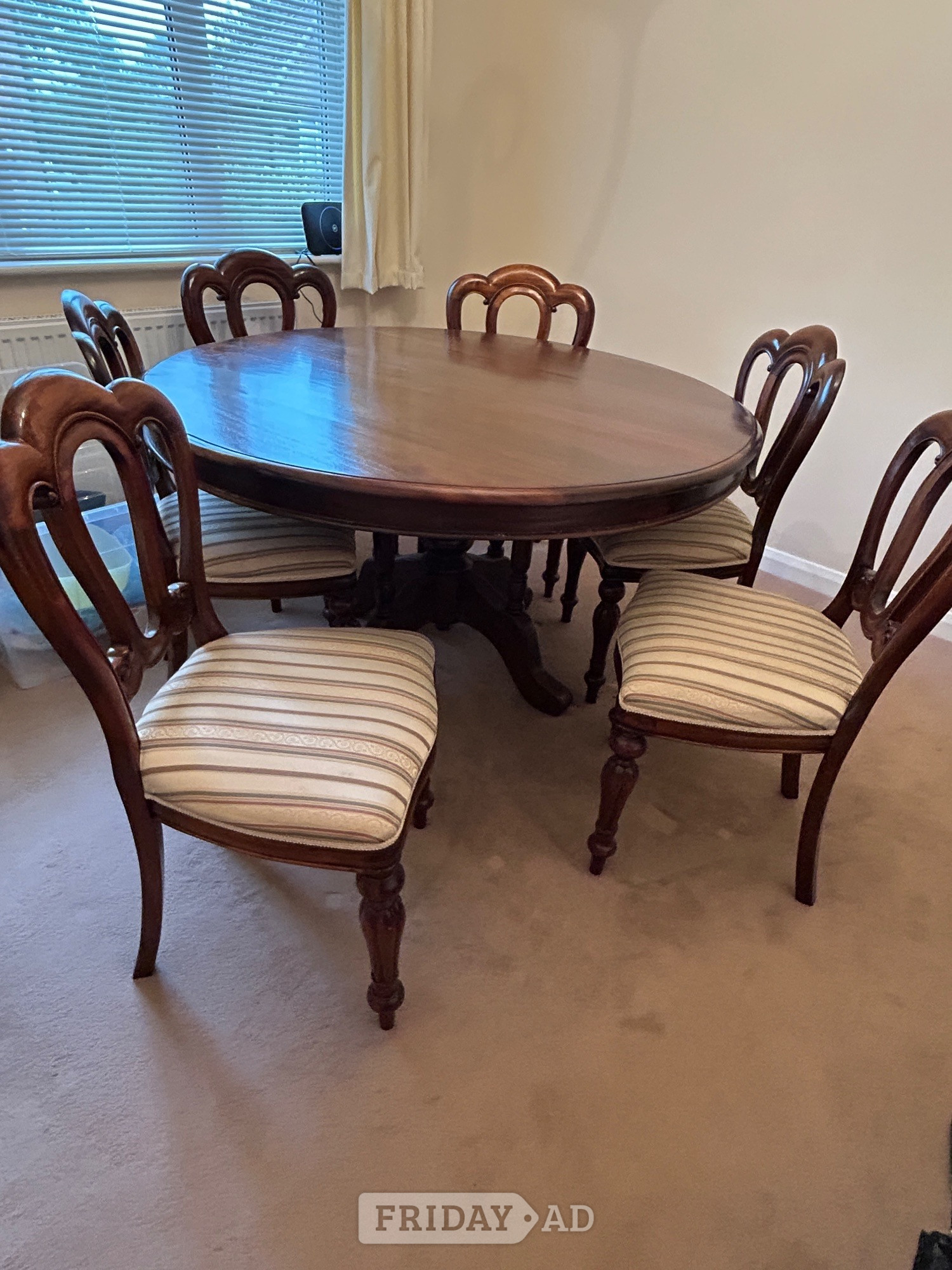 Mahogany round dining room table with 6 matching chairs. - Furniture in Haywards Heath