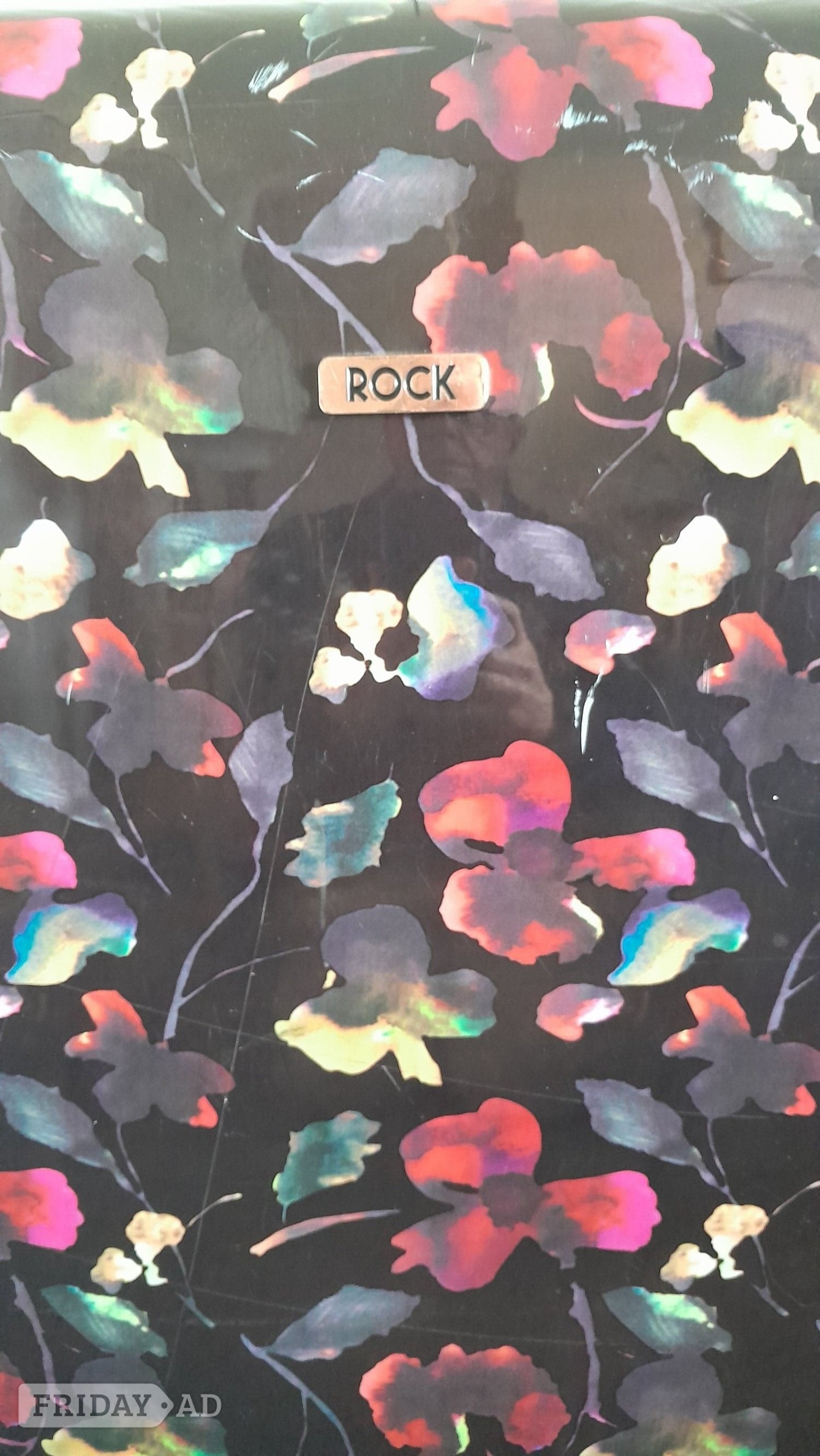 Rock, large, hard shell, four spinner wheeled  suitcase.