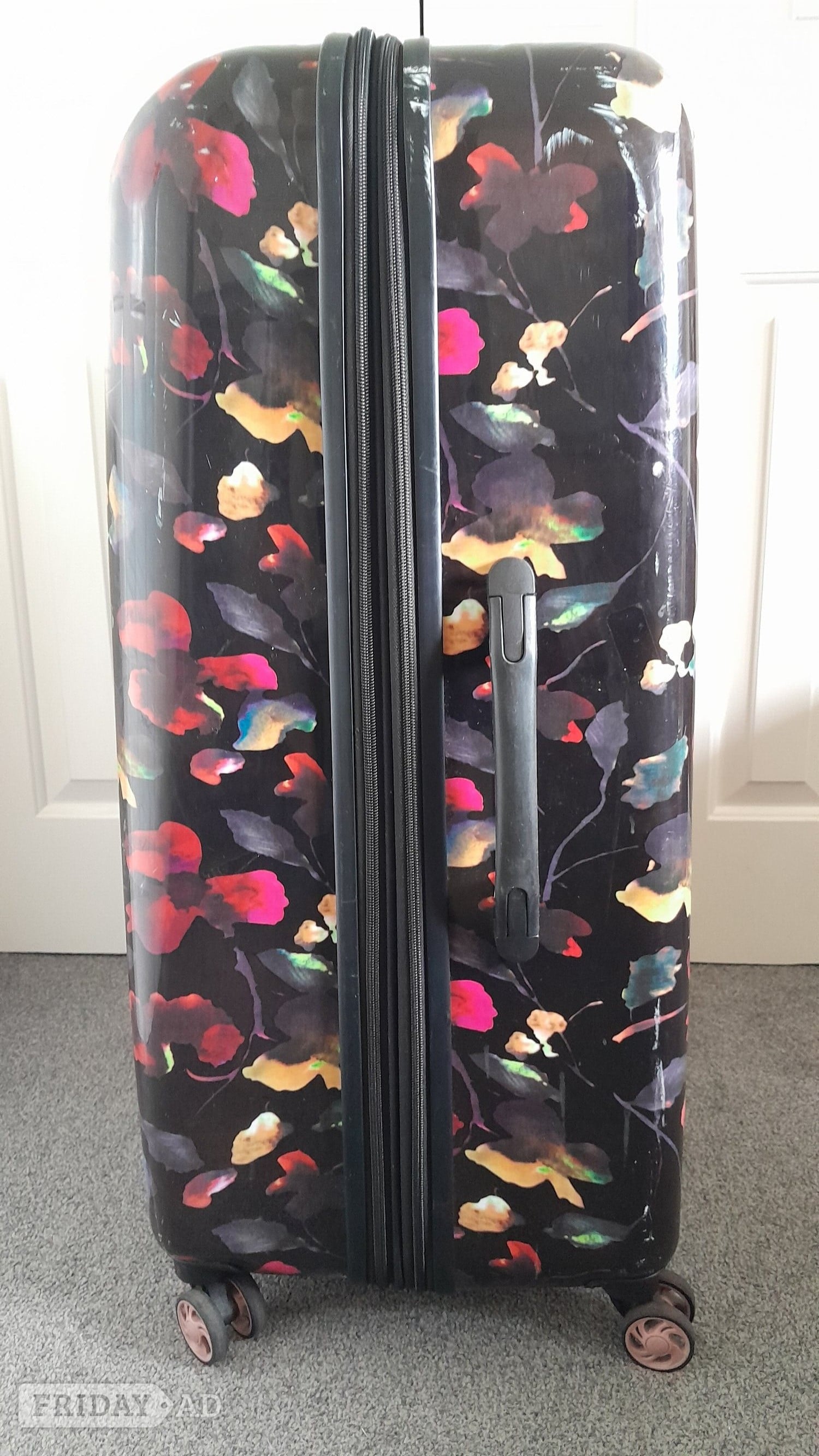 Polegate Rock, large, hard shell, four spinner wheeled  suitcase.
