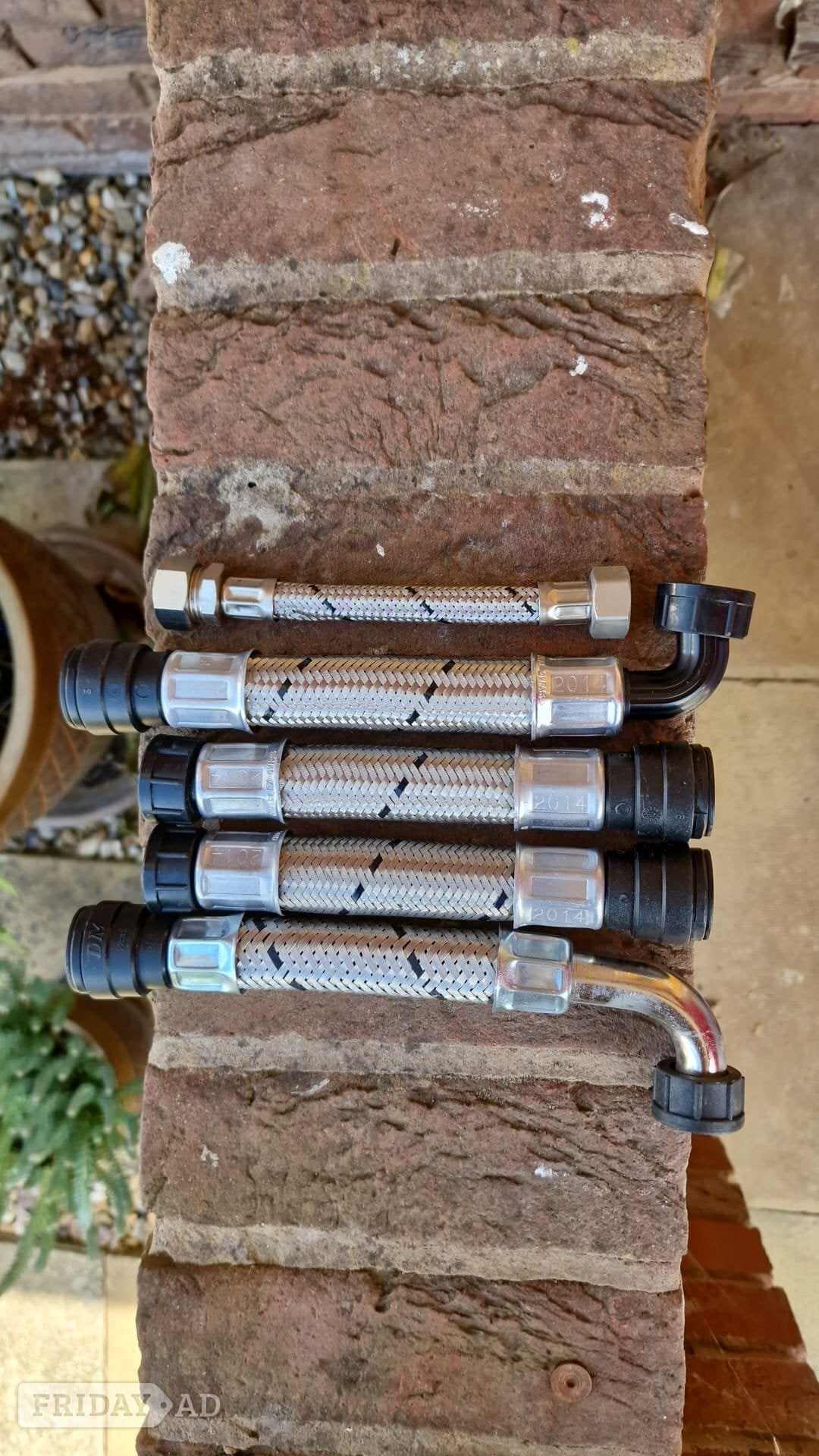 Set of flexible metal hoses with connectors. in Crawley