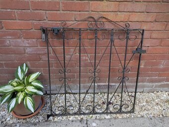 Black pedestrian wrought iron gate