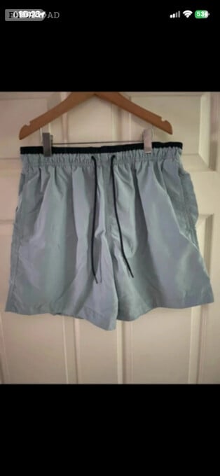H&M turquoise swimming shorts in size medium