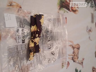 Black head band with yellow sun flowers