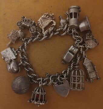 Silver charm bracelet with 14 charms 