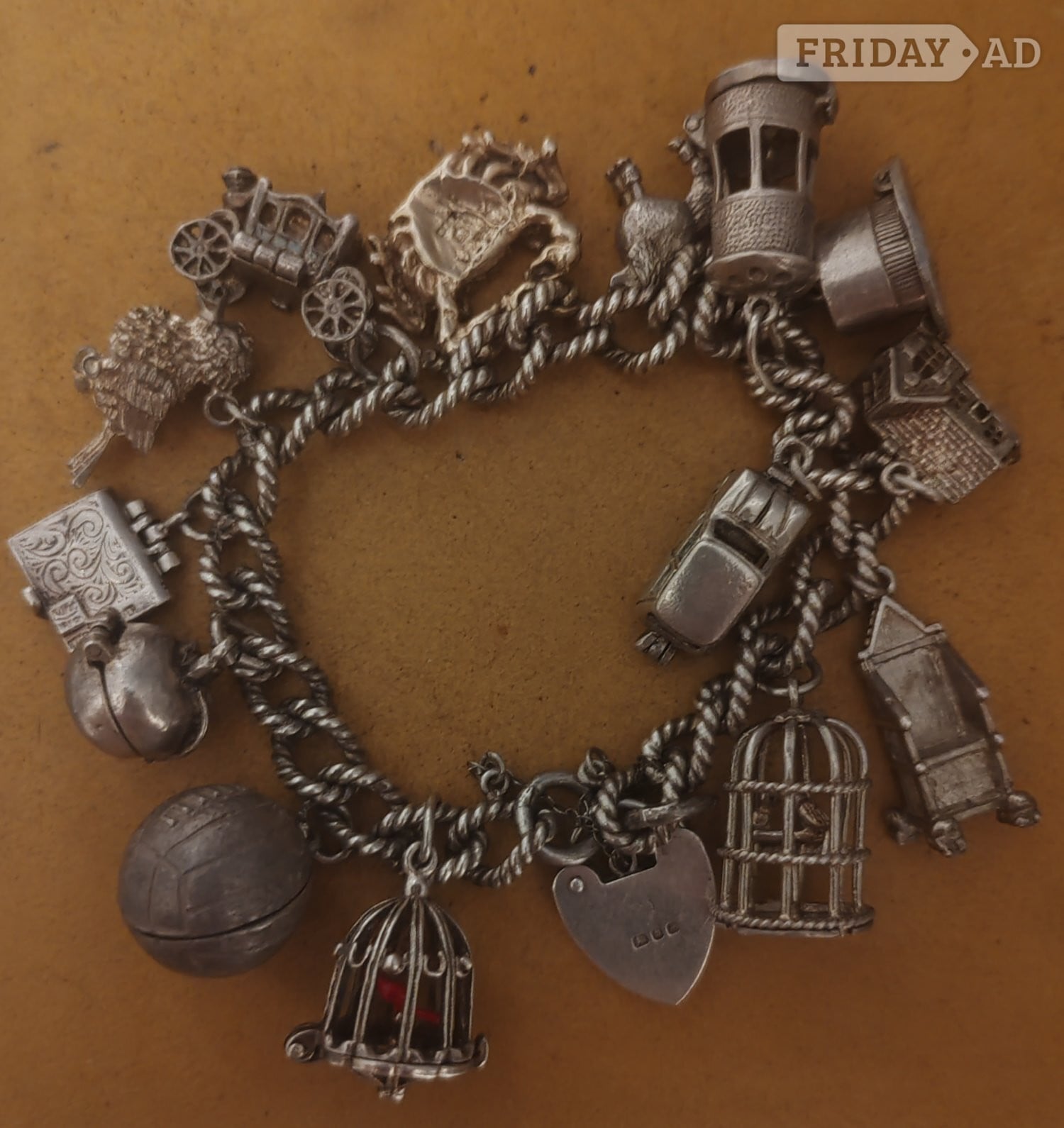 Silver charm bracelet with 14 charms  in Cranbrook