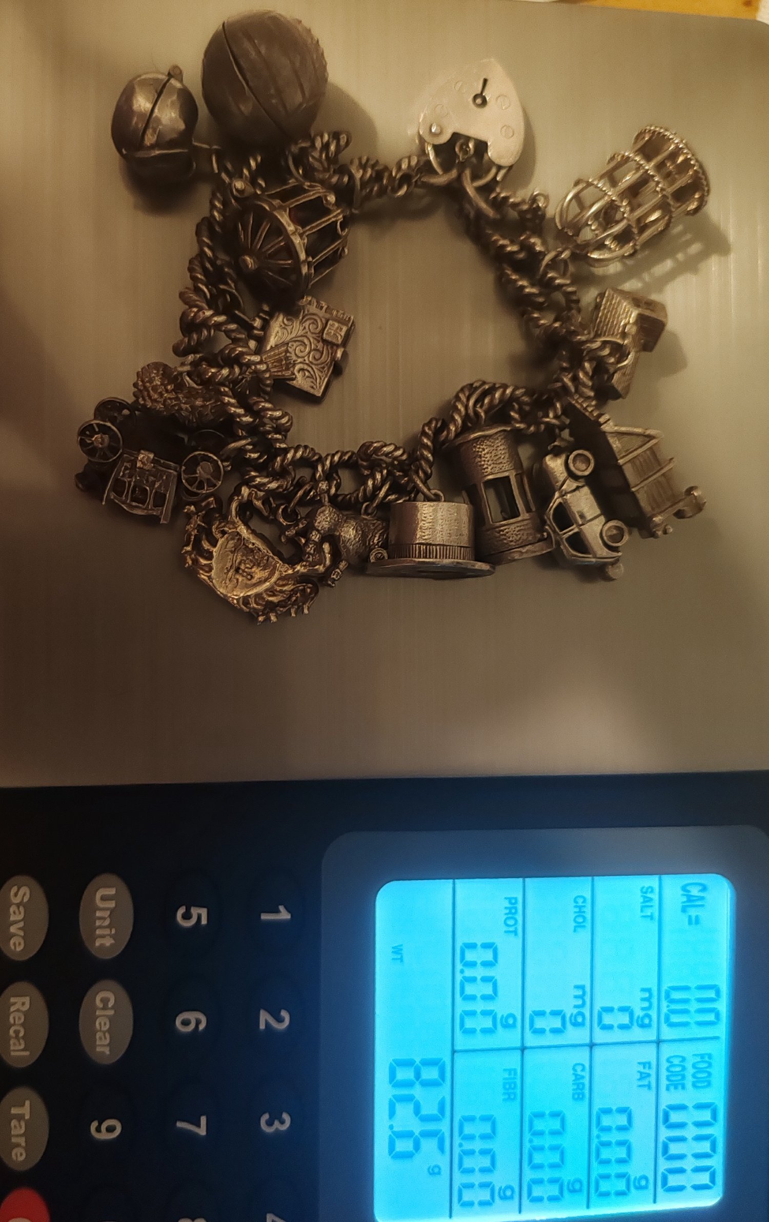 Silver charm bracelet with 14 charms 