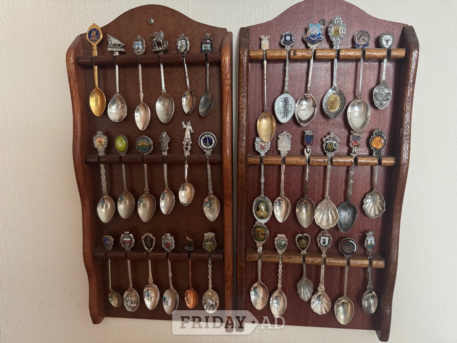 Commemorative Spoons from around the world mounted in racks