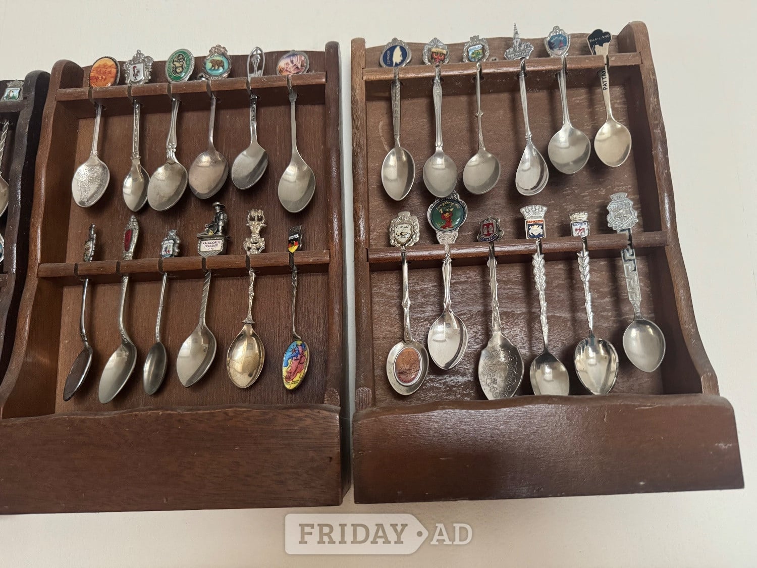 Worthing Commemorative Spoons from around the world mounted in racks