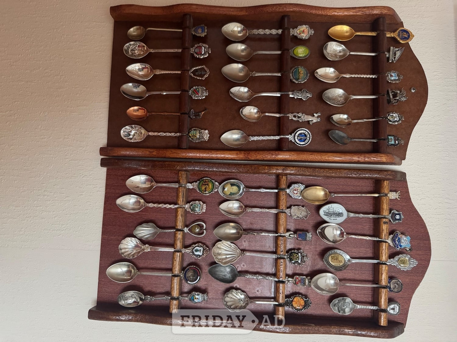 Commemorative Spoons from around the world mounted in racks - Antiques & Collectables