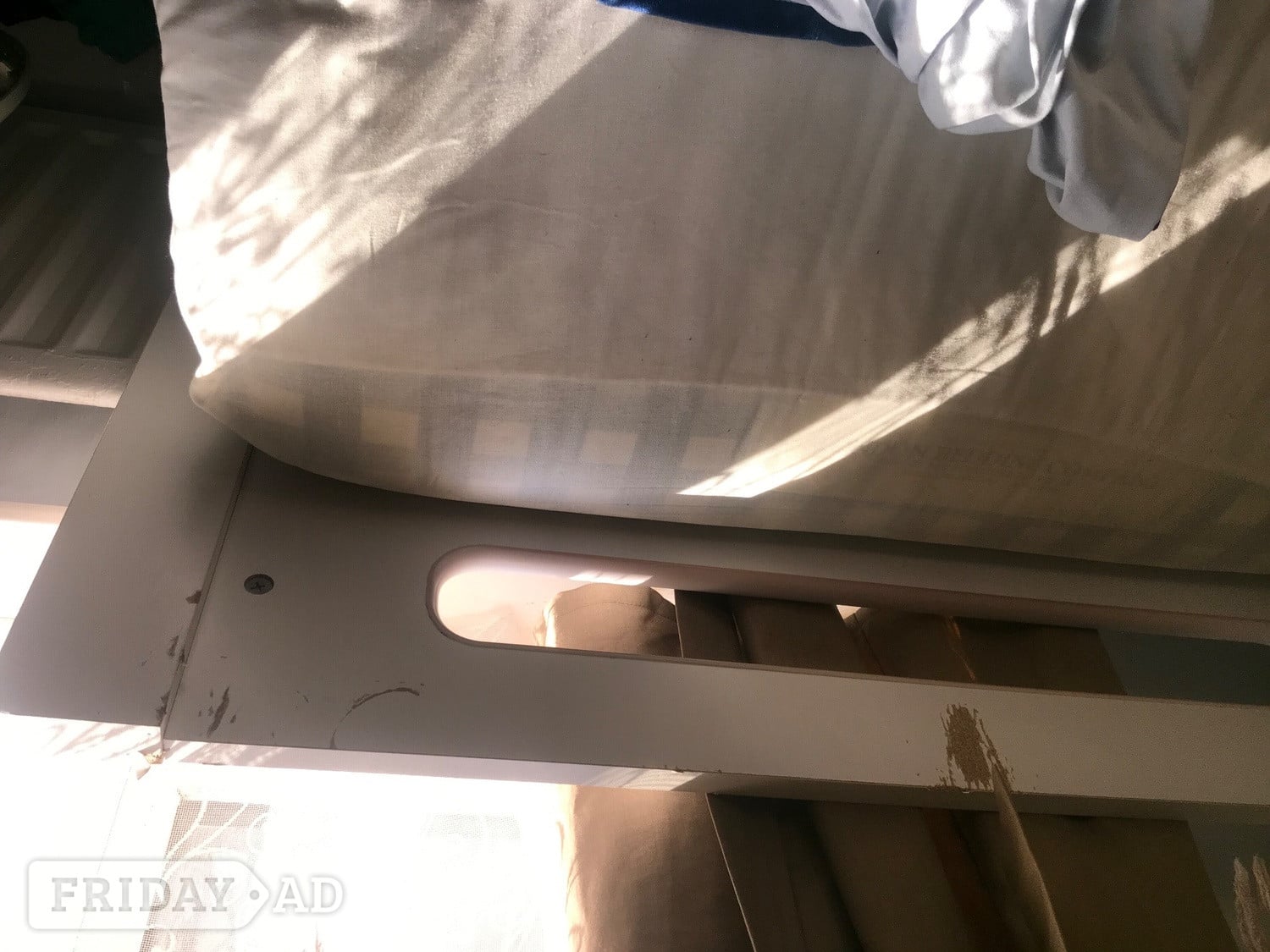 Reigate White wooden single bed with a pull-out trundle bed underneath
