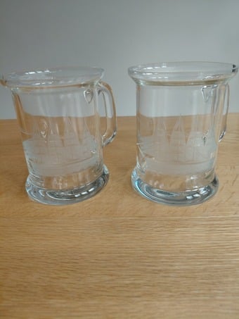 Pair of Glass Tankards with Etched Ship Design – Good Condition