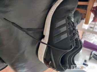 Female Adidas black trainers 