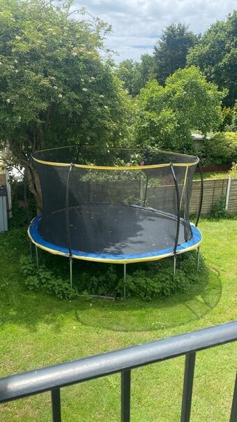 Trampoline 14ft in good condition with safety net and steps.