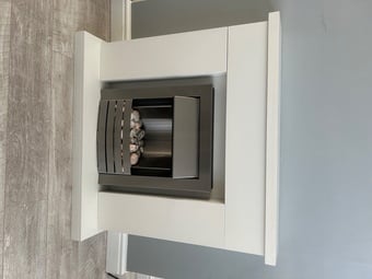 Electric fire with ornamental surround 
