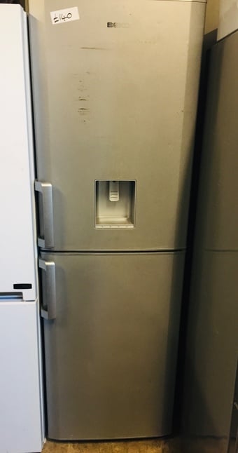Beko Silver fridge freezer with water dispenser .