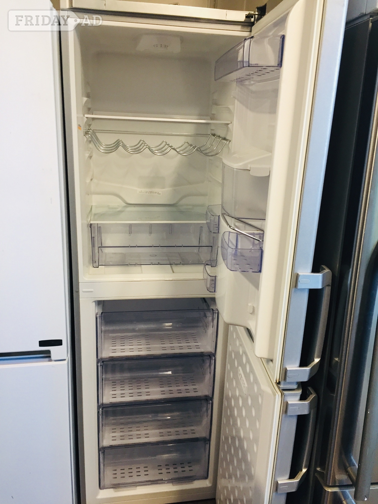 Beko Silver fridge freezer with water dispenser .