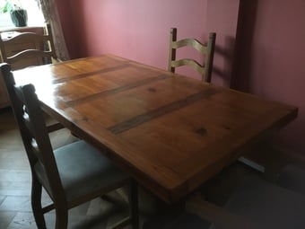 Beautiful pine table and chairs. The table dismantles.