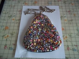 Beaded multi coloured clip top bag