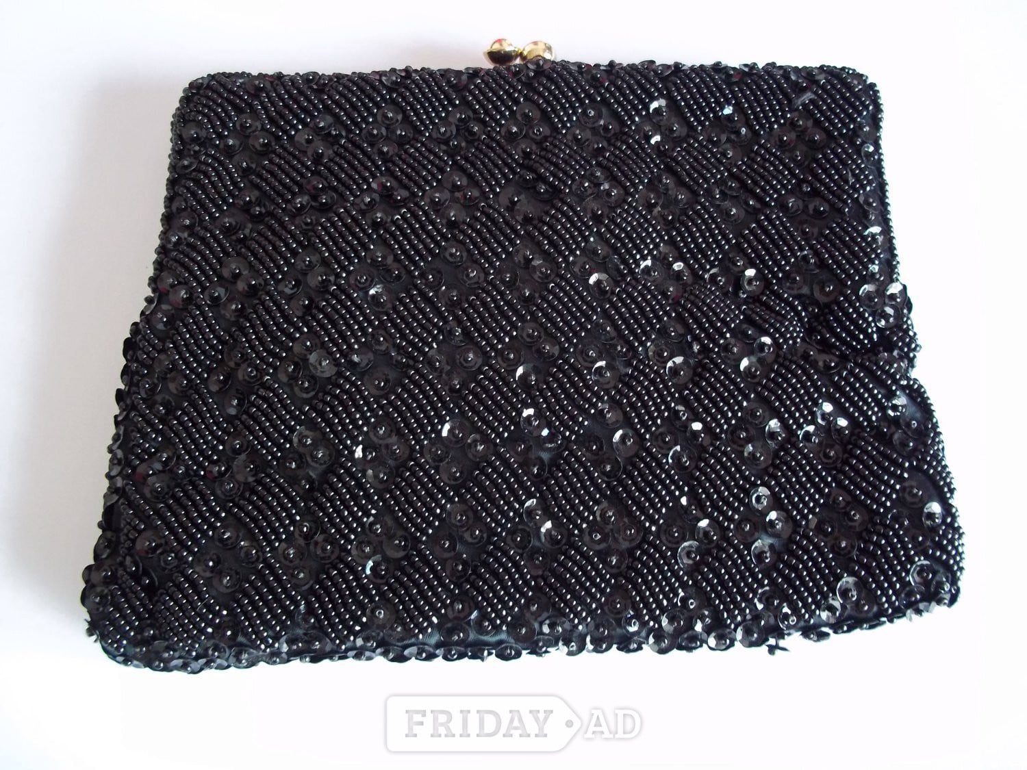 Clip top small black beaded clutch bag in Lewes