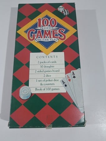 BOOK OF 100 INDOOR GAMES PLUS GAMING PIECES.  1988.  UNUSED