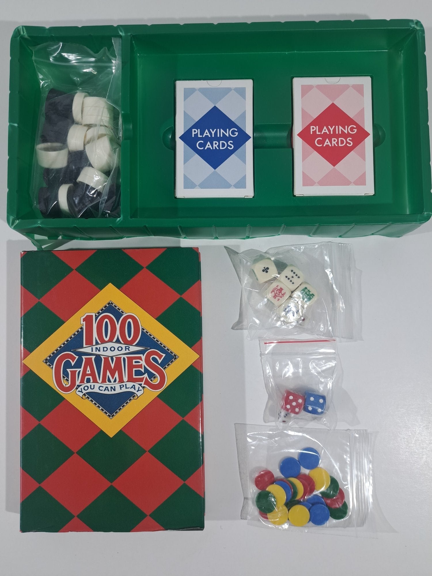 BOOK OF 100 INDOOR GAMES PLUS GAMING PIECES.  1988.  UNUSED