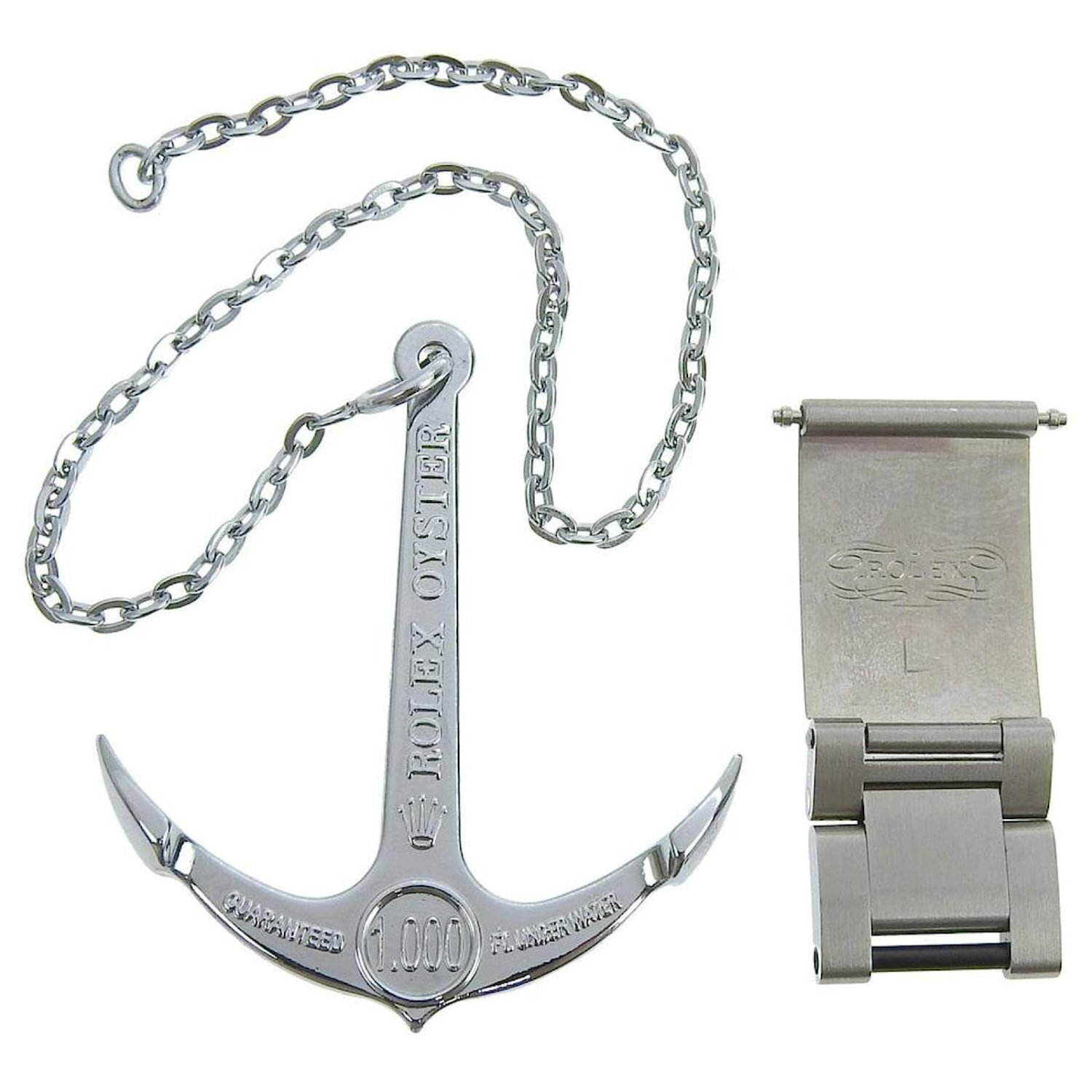 Rolex Sea Dweller anchor, and large extension bracelet link.