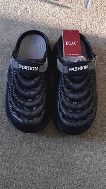 New, never worn, platformed clogs with cushioned soles, in black