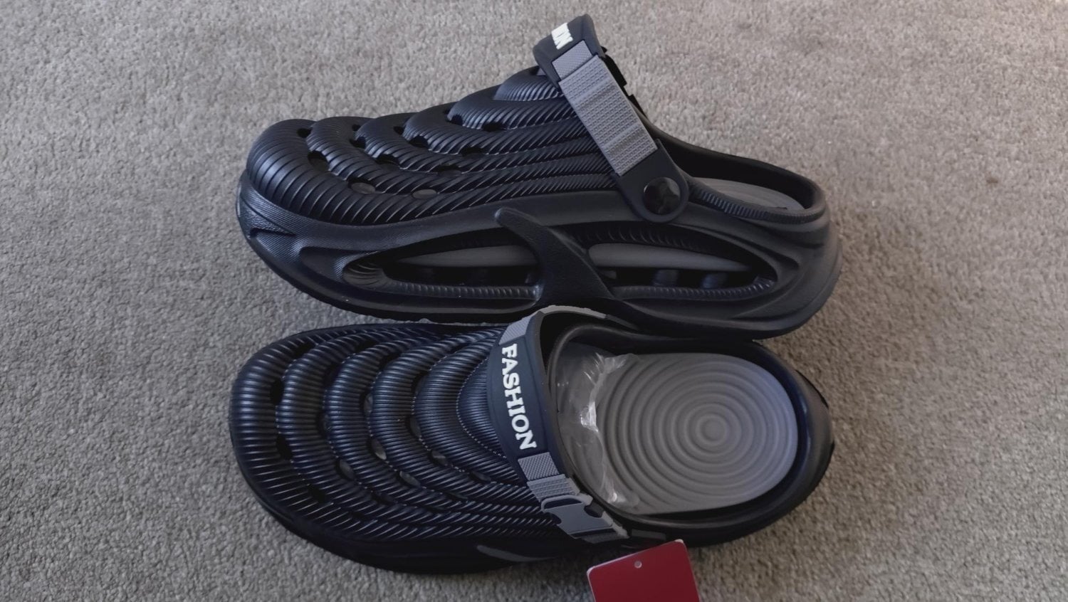 New, never worn, platformed clogs with cushioned soles, in black